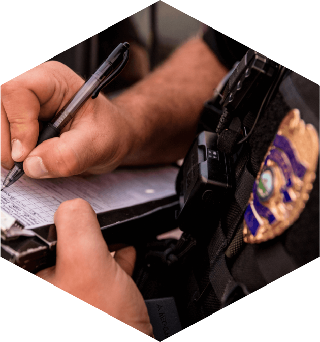 law enforcement officer signs papers